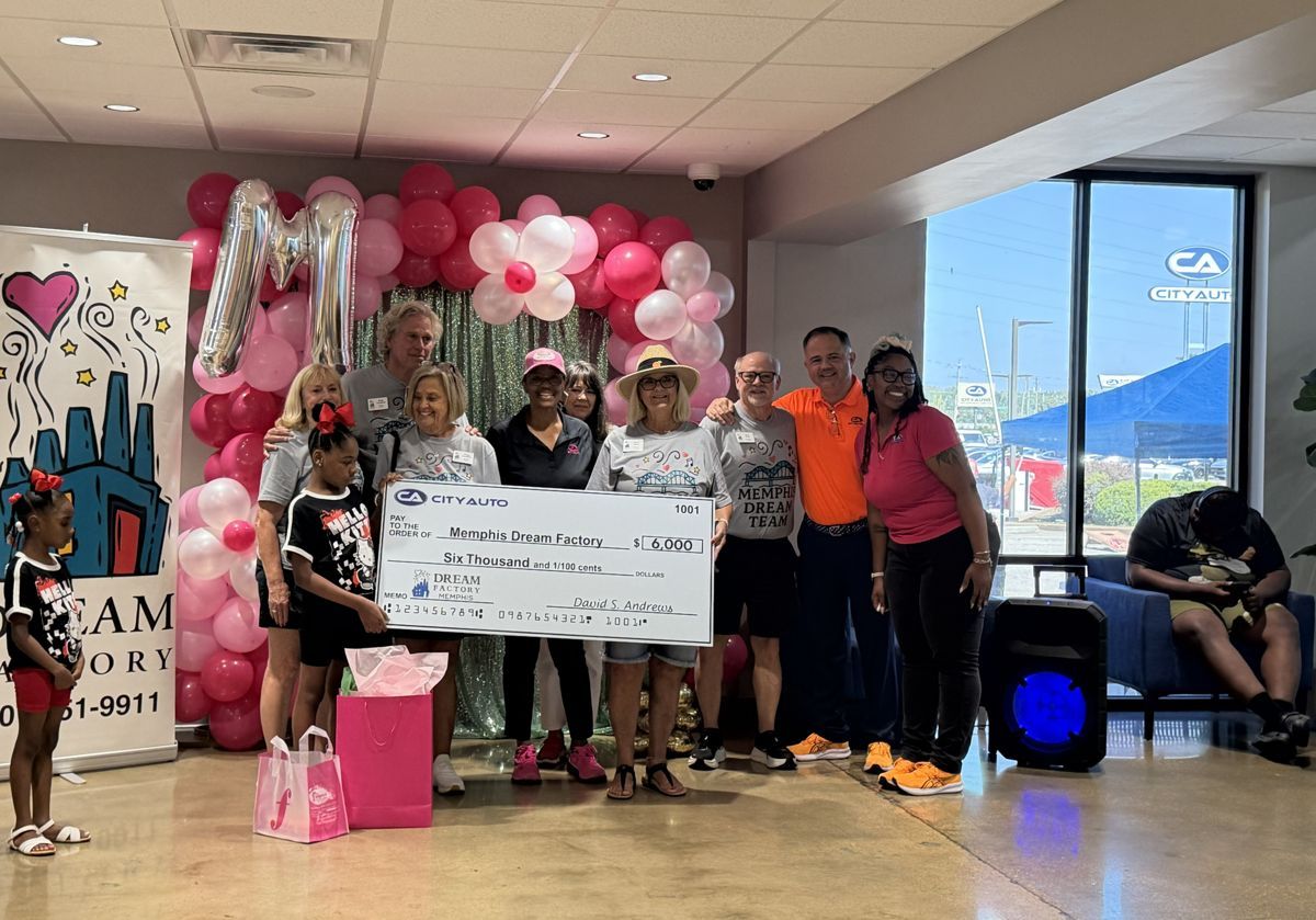 City Auto Sales presenting a $6,000 check to the Memphis Dream Team